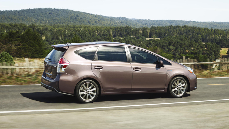 Prius v driving along a mountain road