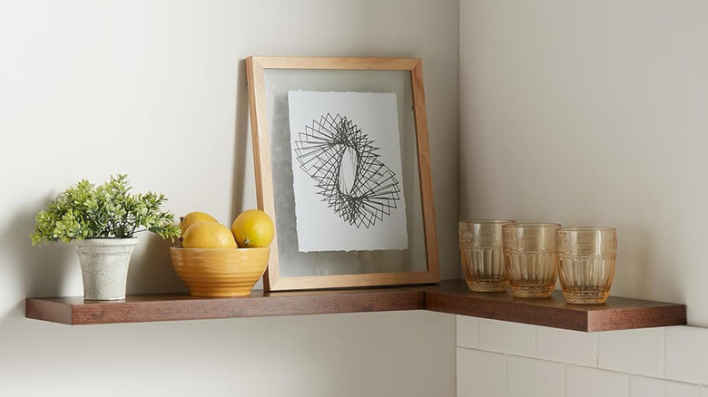 A floating shelf in a kitchen corner