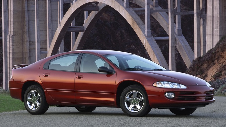 A 2004 intrepid SXT is parked near a large concrete arch bridge.