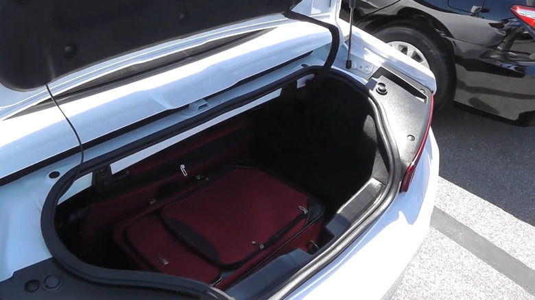 A white 2016 Chevy Camaro LT with its trunk open