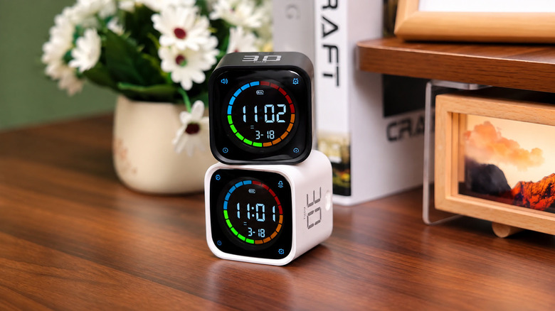 Two pomodoro timer cubes on a desk