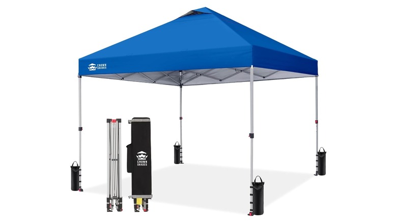 Four-sided canopy tent with blue fabric roof