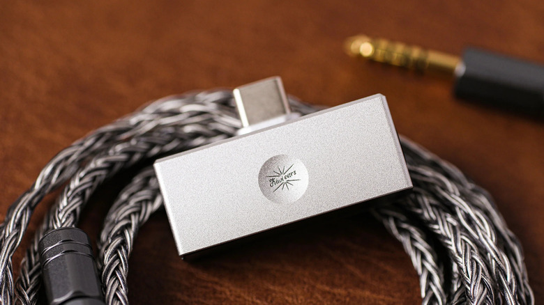 A Linsoul Kiwi Ears Allegro Mini on top of a cable