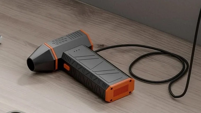 A WOLFBOX MegaFlow 50 electric duster on top of a table