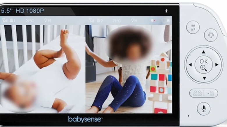 A babysense monitor with a baby and woman blurred out.