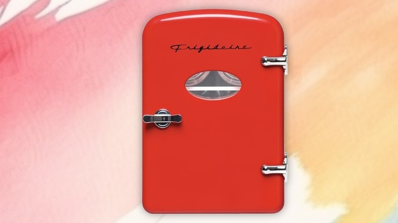 Frigidaire-brand Minifridge on a painted background.