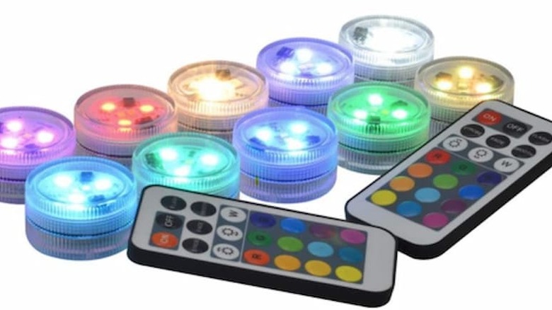 A bunch of Kitosun Submersible LED Lights next to two remotes.