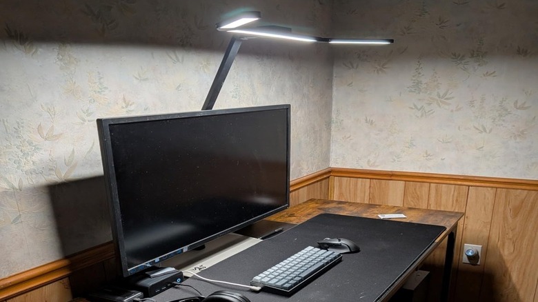 An Airlonv LED desk lamp illuminating a work area