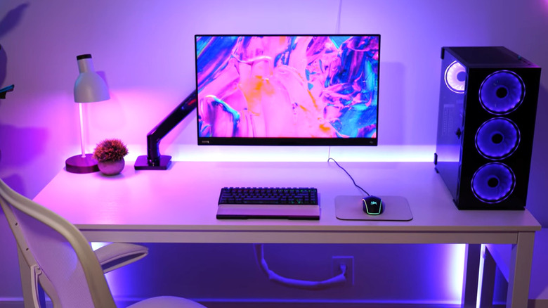 An ErGear Monitor Arm supporting a screen in a gaming setup