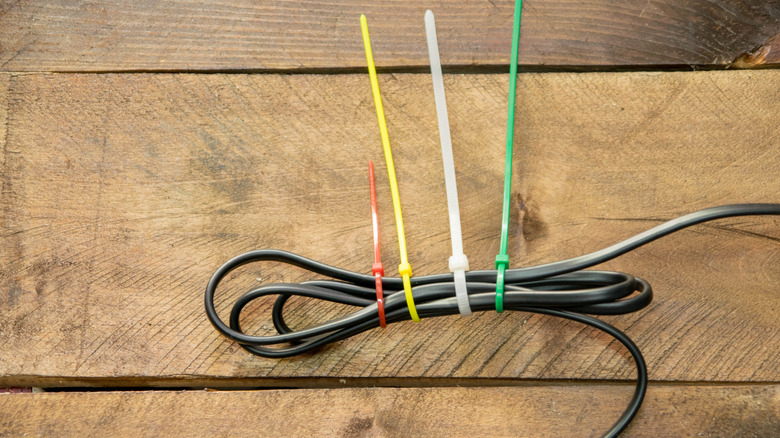 Different colored zip ties attached to a cable