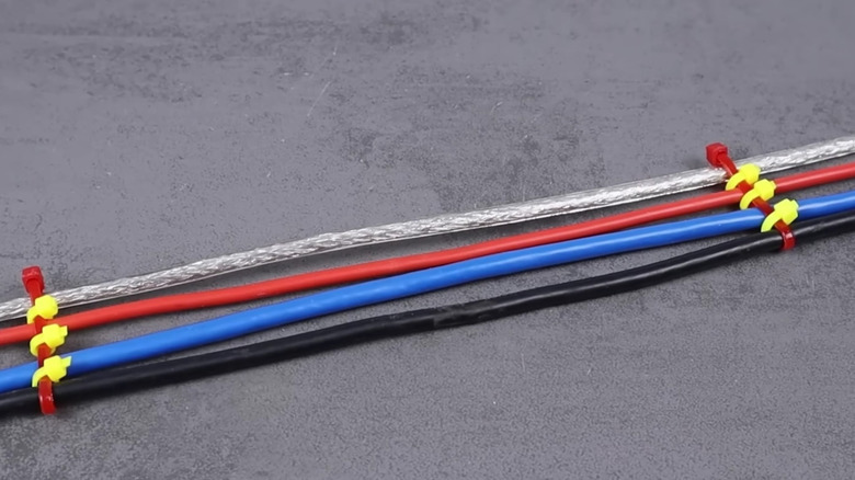 Four cables spaced out and held by zip ties