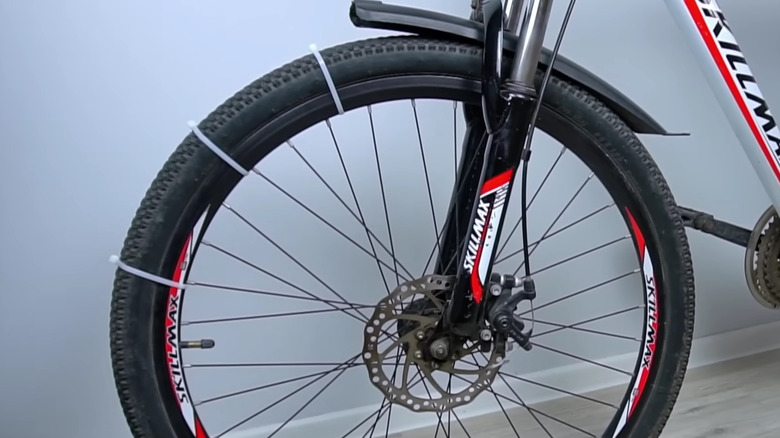 Front bike tire with zip ties on it