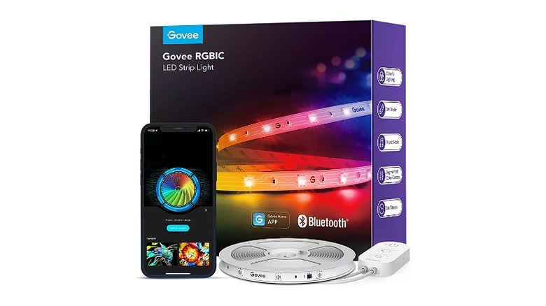 A set of Govee RGBIC LED strip lights, its packaging, and and a smartphone showing the Govee app, all against a white background