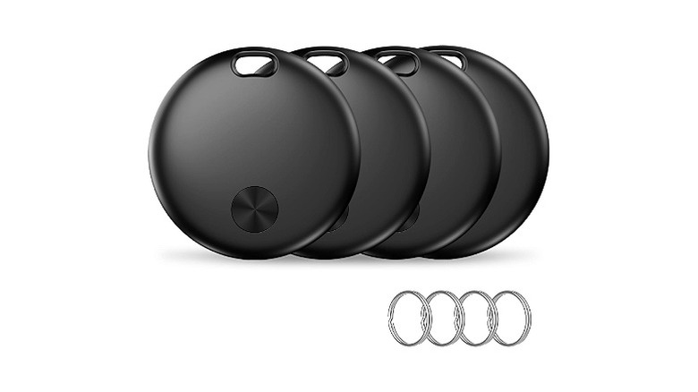 Four black circular trackers with four silver rings
