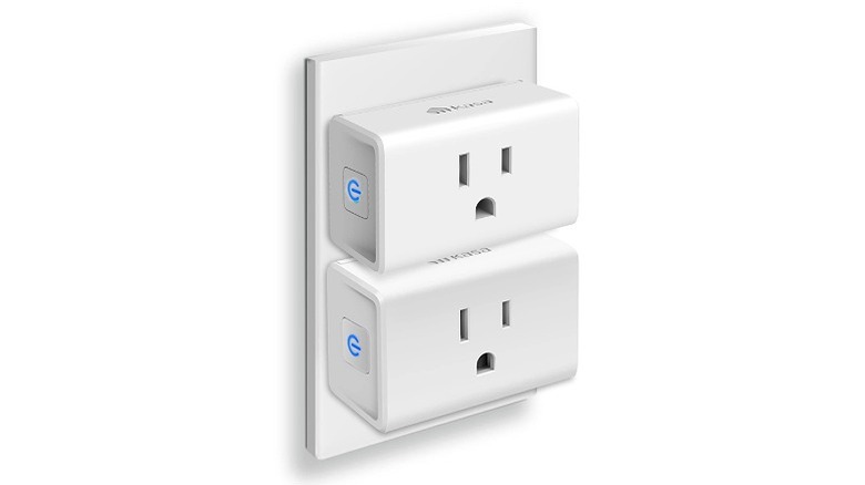 Two Kasa smart plugs plugged into an electrical outlet