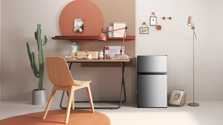 A tastefully-decorated home office featuring a Hisense mini-fridge