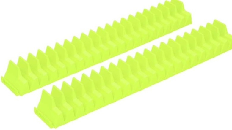 Two green wrench holders