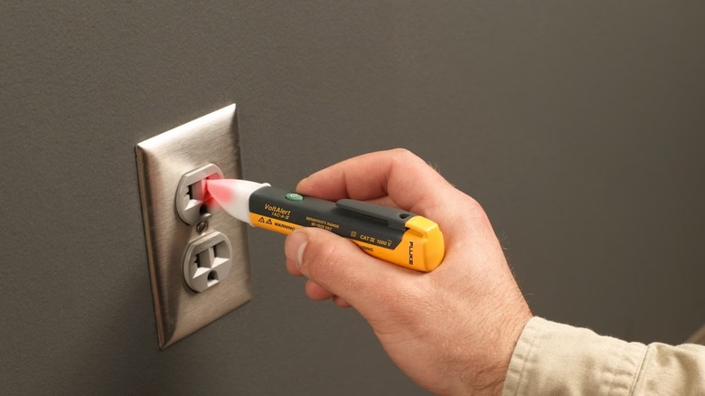 Voltage tester in electrical outlet