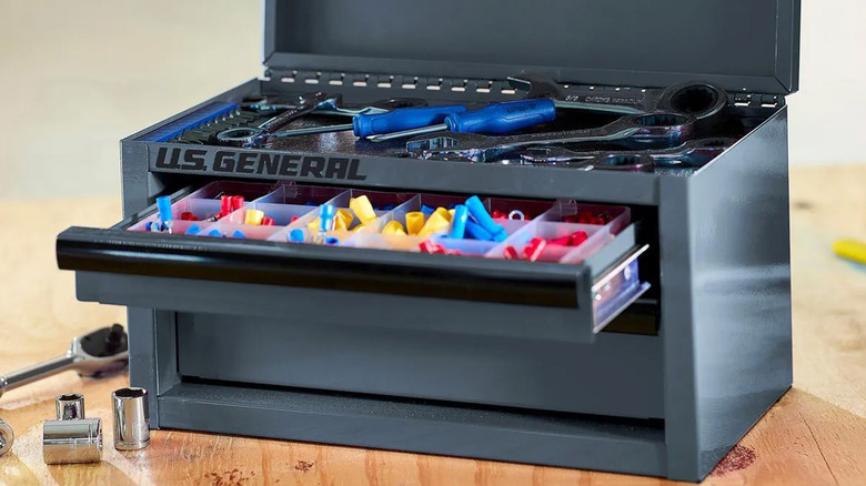 A black U.S. General mini toolbox holding tools and accessories