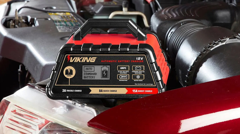 A Viking battery charger charging a car battery