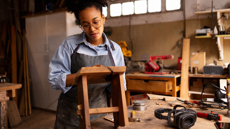 woman in a workshop near her workbench