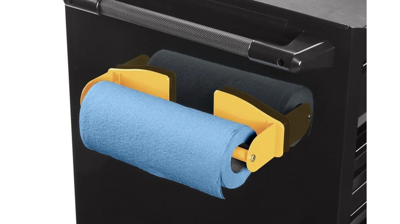 U.S. General Magnetic Paper Towel Holder affixed to the side of a black metal roll cab