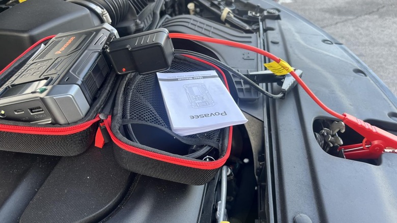 A car being jumpstarted using Povasee.