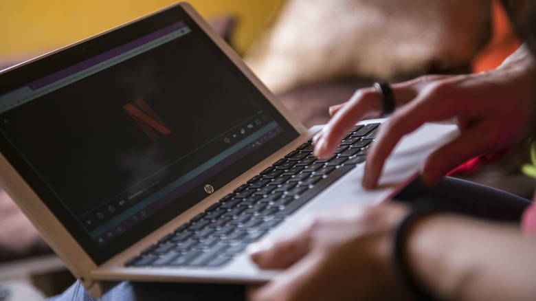 Woman using Netflix on laptop