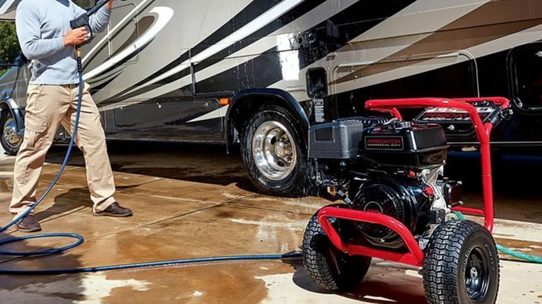 spraying RV with predator pressure washer