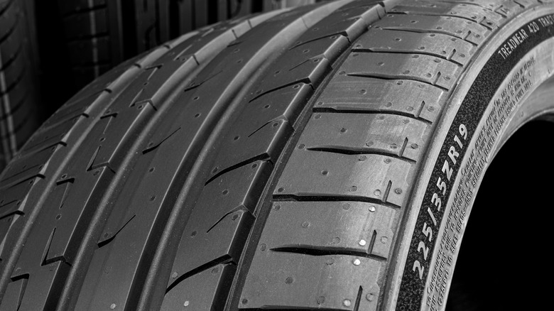 Close up photo of a tire with tire profile mentioned on the sidewalls