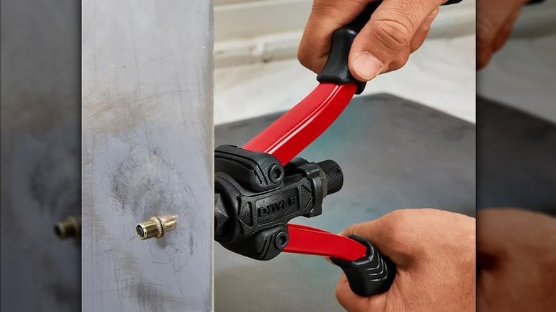 Using a Doyle rivet nut setter to work on a fastener.
