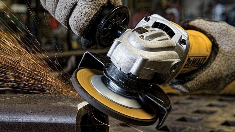 A grinder being used on a piece of metal.