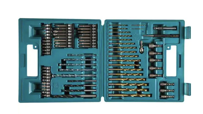 A power drill being used to nail in a screw.