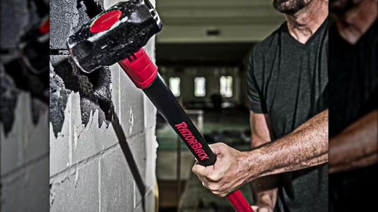 breaking up comcrete block wall with Razor-Back sledge hammer