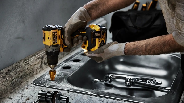Person using DeWalt cordless drill