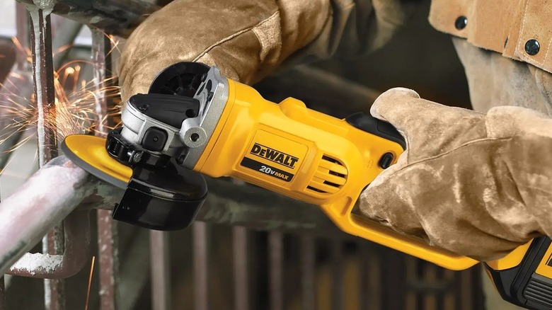 Person using DeWalt angle grinder