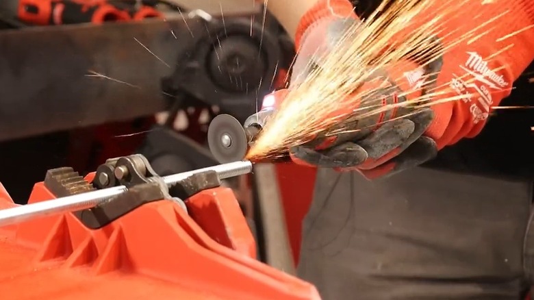 Person using Milwaukee rotary tool