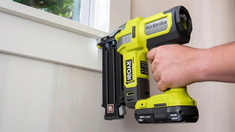 Person using Ryobi AirStrike brad nailer