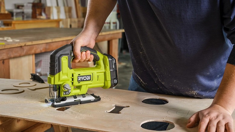 Person using Ryobi jig saw