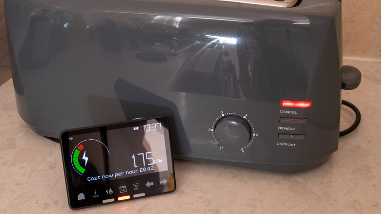 A black toaster next to a display