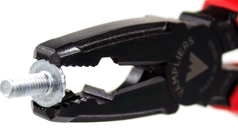 A set of Vampliers gripping a stripped screw