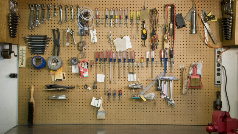 tools hanging on pegboard in garage