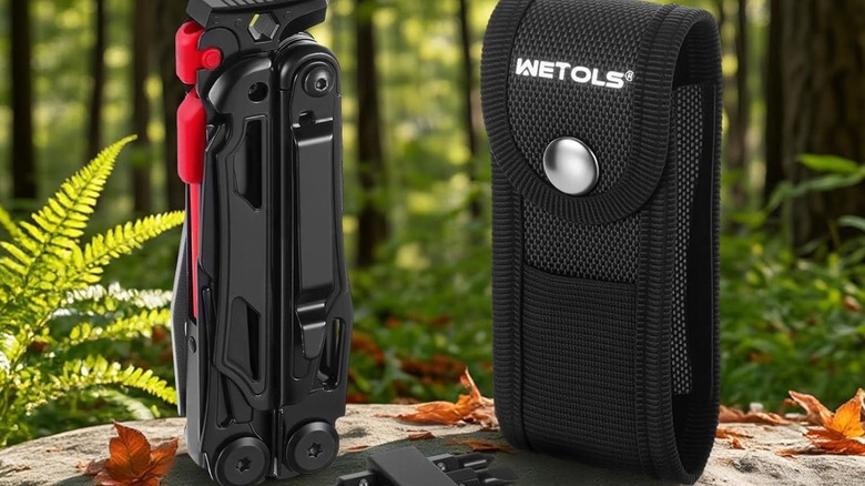 Wetols Multi-Tool standing next to case on a rock