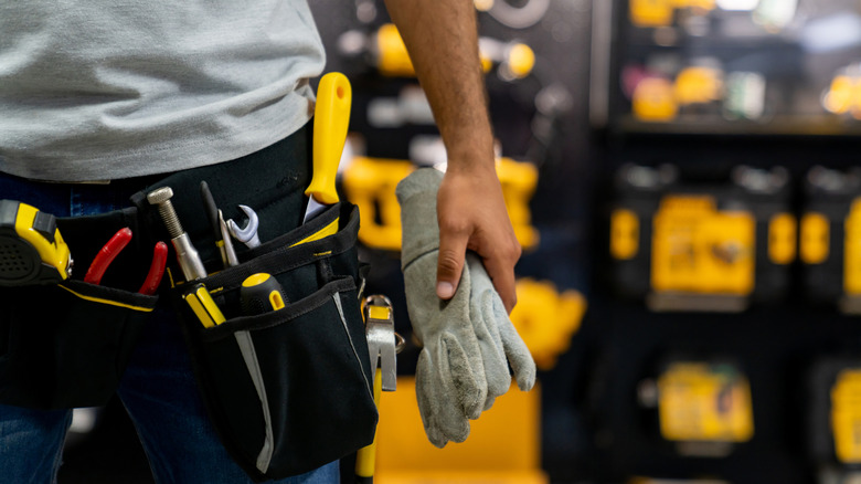 closeup of person wearing toolbelt