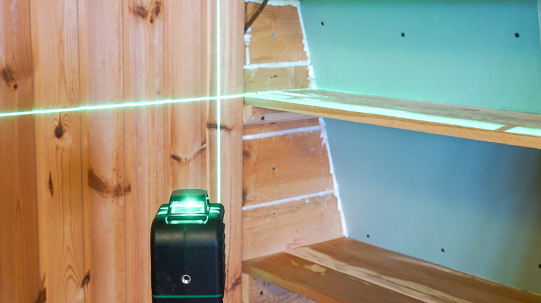 laser level aimed at shelves