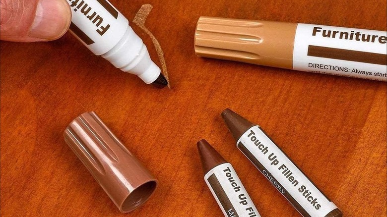 using a touch up market on wood surface