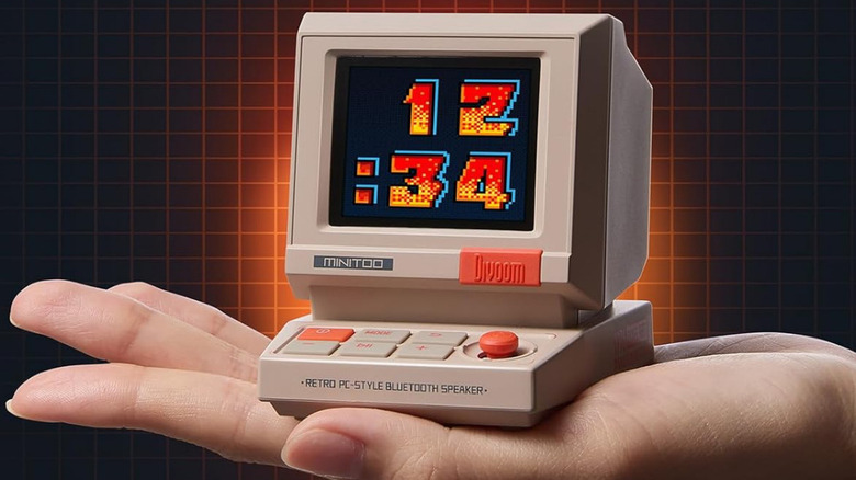 The Divoom MiniToo in the palm of a hand.