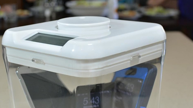 Smartphones locked up in the Kitchen Safe Time Lock Safe.