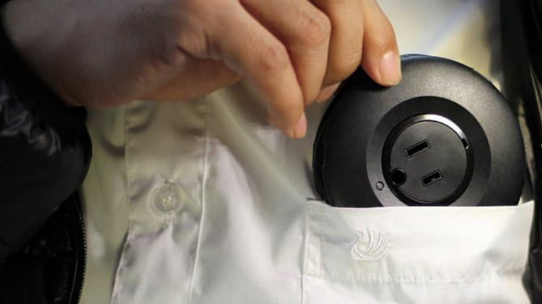 fitting a Mogics Bagel Universal Power Strip into a shirt pocket.