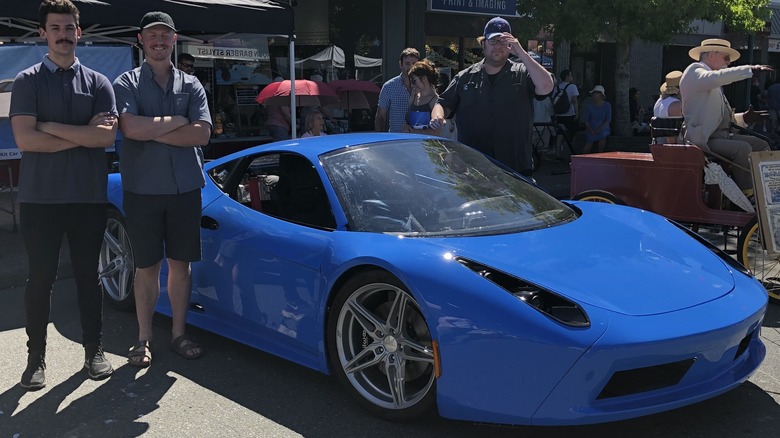 Arma GT with team members